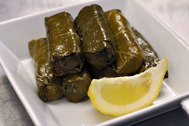 Dolmades, hand wrapped grape leaves