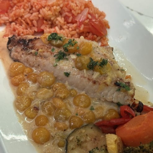 Black fish with Husked tomatoes